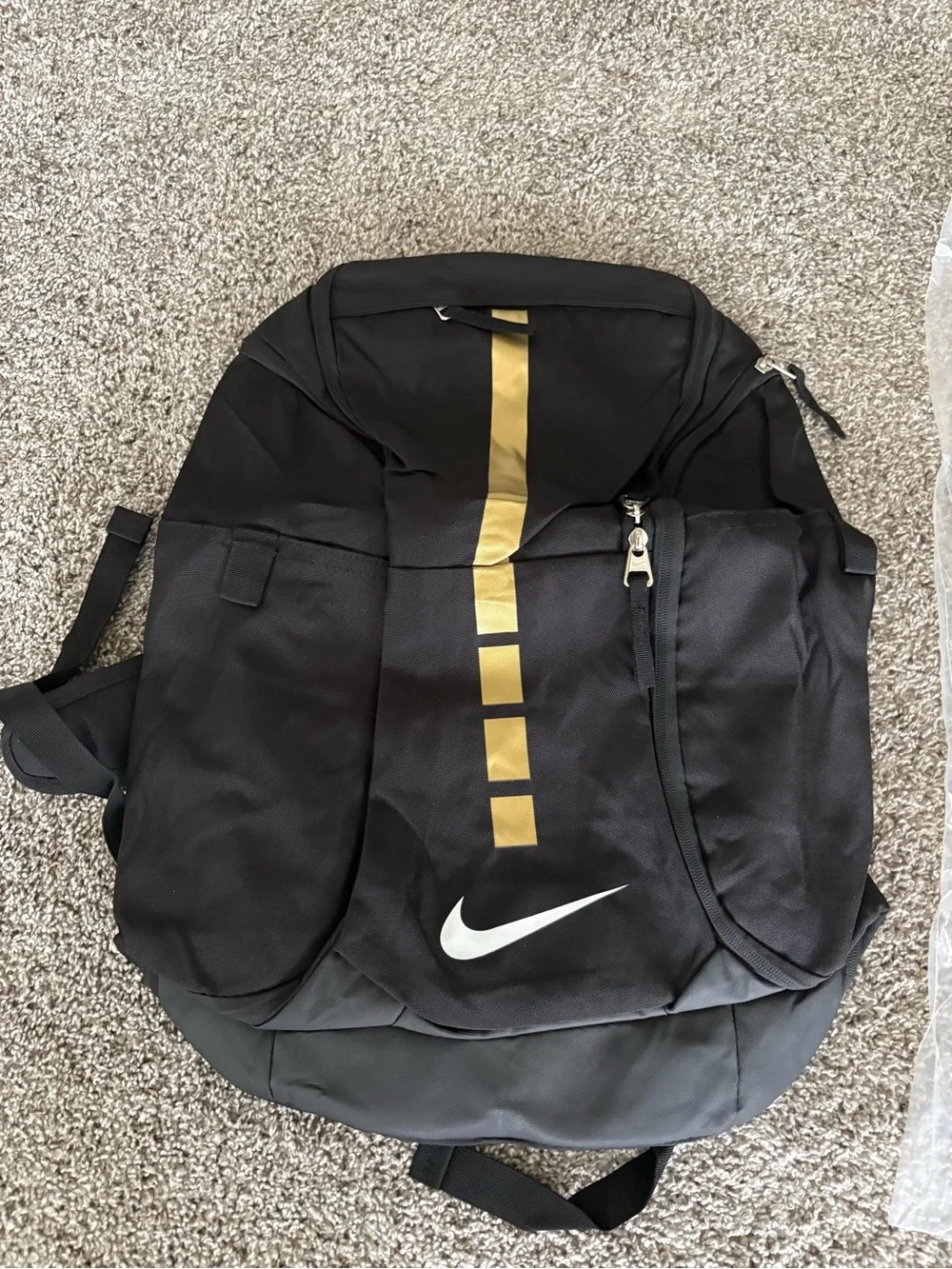 Nike Black Backpack with Gold Stripe and White Swoosh